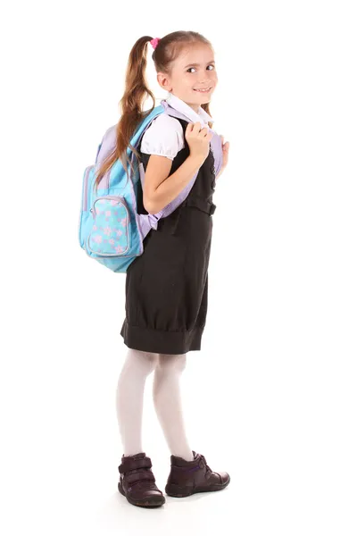 Portrait of beautiful little girl in school uniform with backpack. Isolated — Stock Photo, Image