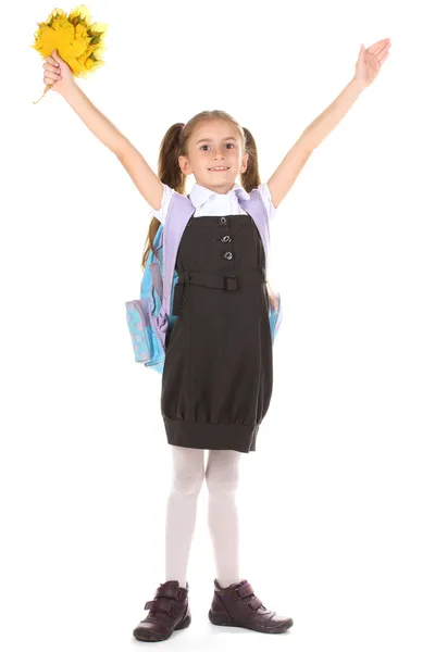 Portrait of beautiful little girl in school uniform with backpack and autum — Stock Photo, Image