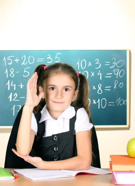 Little schoolchild in classroom near blackboard — Stock Photo, Image