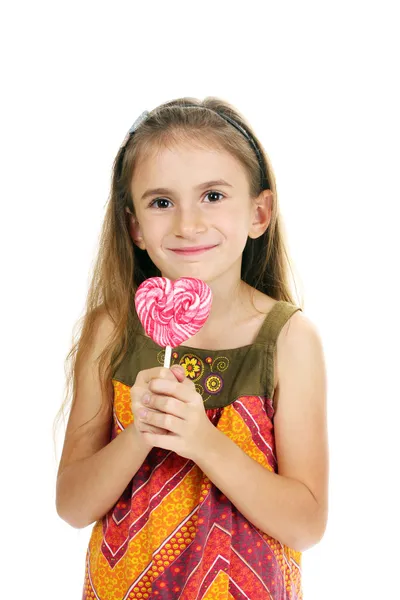 Mooi klein meisje en snoep op stick geïsoleerd op wit — Stockfoto