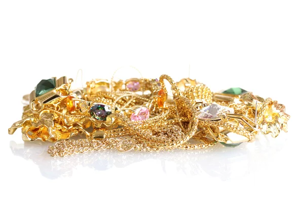 Varias joyas de oro aisladas en blanco — Foto de Stock