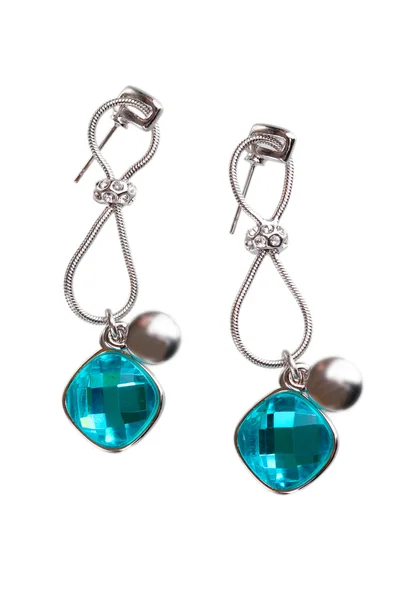 Beautiful silver earrings with precious stones isolated on white — Stock Photo, Image