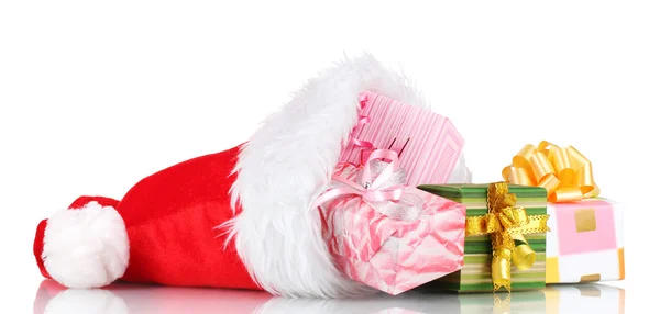 Beautiful Christmas hat and gifts isolated on white — Stock Photo, Image
