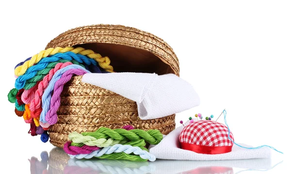 stock image Bright threads for needlework and fabric in a wicker basket