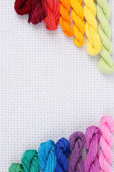 Sewing threads for embroidery on white cotton — Stock Photo, Image
