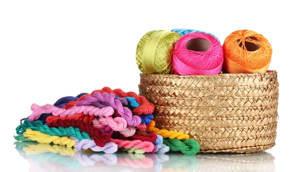 Bright threads for needlework and fabric in a wicker basket — Stock Photo, Image