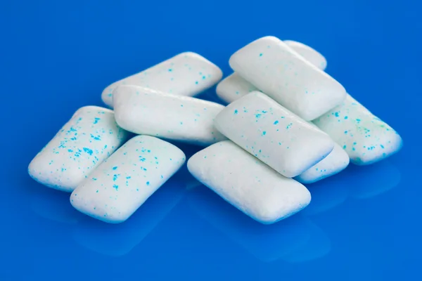 stock image Chewing gums on blue background