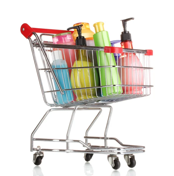 Carrito de compras con botellas de detergente aisladas en blanco —  Fotos de Stock