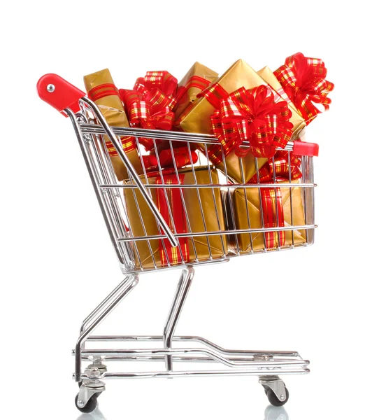 Beautiful golden gifts with red ribbon in shopping cart isolated on white — Stock Photo, Image