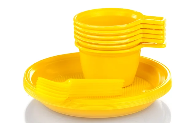 Bright yellow plastic tableware isolated on white — Stock Photo, Image