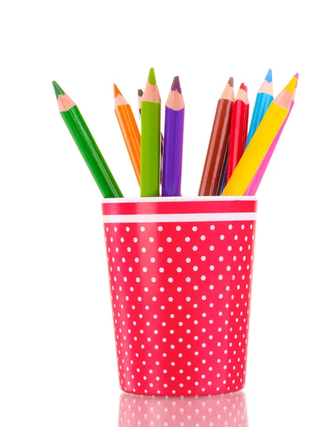 Red glass with colorful pencils isolated on white — Stock Photo, Image