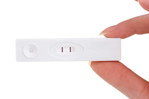 Test di gravidanza in mano isolato su bianco — Foto Stock
