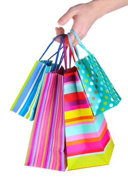 Bright gift bags in hand isolated on white — Stock Photo, Image