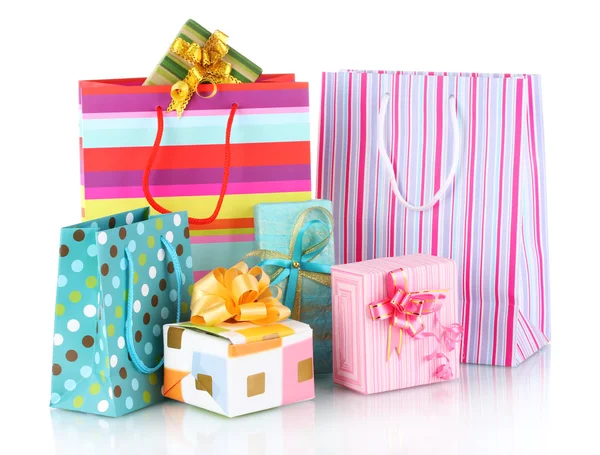 Bolsas de regalo brillantes y regalos aislados en blanco —  Fotos de Stock