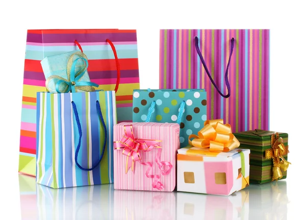 Bolsas de regalo brillantes y regalos aislados en blanco —  Fotos de Stock