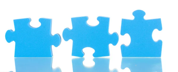 Blue puzzles closeup, isolated on white — Stock Photo, Image