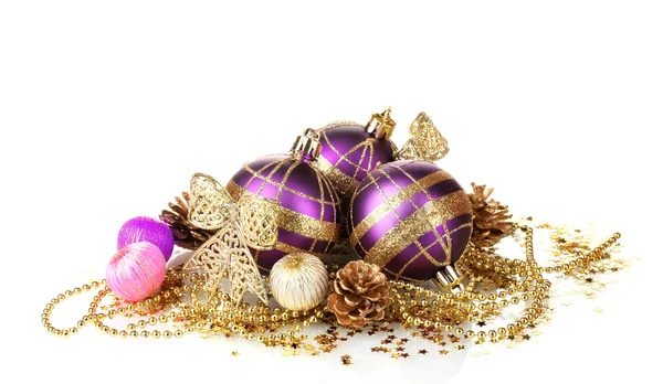 Beautiful purple Christmas balls and cones isolated on white — Stock Photo, Image