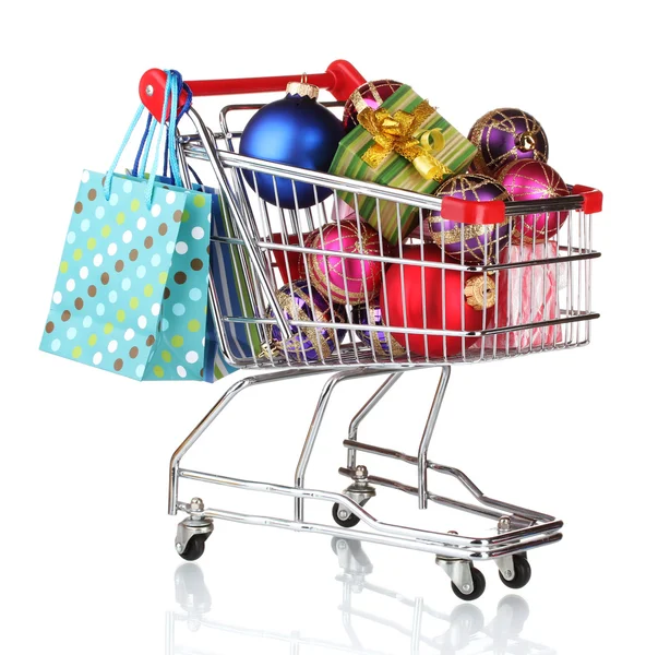Beautiful bright Christmas balls and gifts in the cart and paper bags isola — Stock Photo, Image