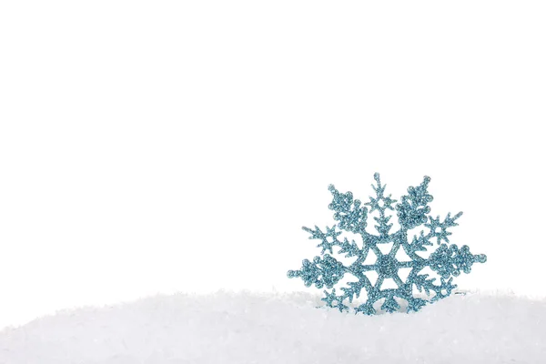 Beautiful snowflake in the snow isolated on white — Stock Photo, Image