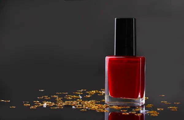 Red nail polish on black background — Stock Photo, Image