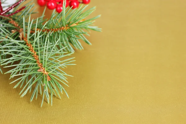 Christmas tree with beautiful New Year's berries on table — Stock Photo, Image