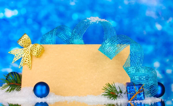 Blank postcard, Christmas balls and fir-tree on blue background — Stock Photo, Image