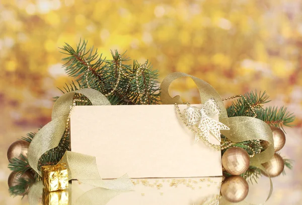 Blank postcard, Christmas balls and fir-tree on yellow background — Stock Photo, Image