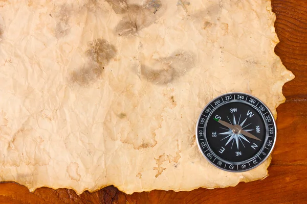 stock image Old paper, compass and rope on a wooden table