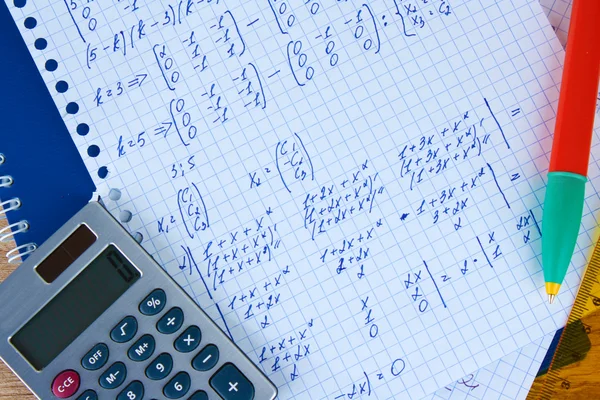Math on copybook page closeup — Stock Photo, Image