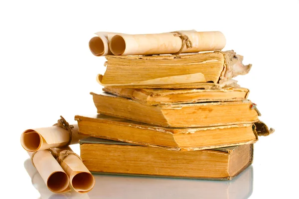 stock image Pile of old books and scroll isolated on white