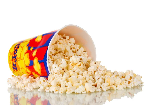 stock image Full bucket of popcorn dropped isolated on white