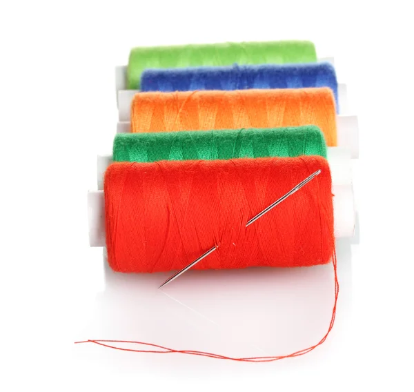 stock image Bobbins of thread with needle isolated on white