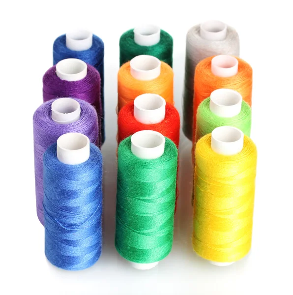 Many-coloured bobbins of thread isolated on white — Stock Photo, Image