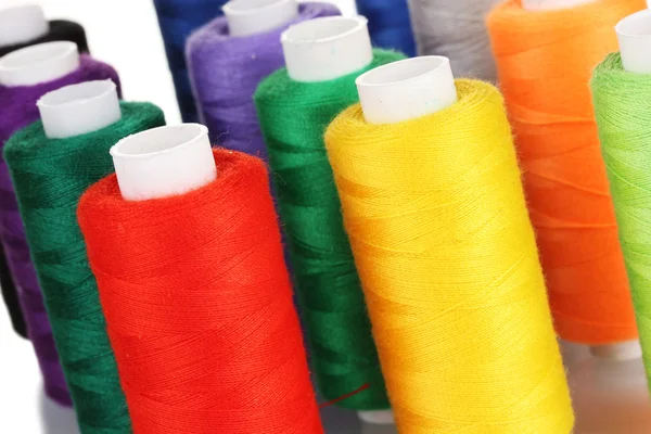 Many-coloured bobbins of thread closeup — Stock Photo, Image