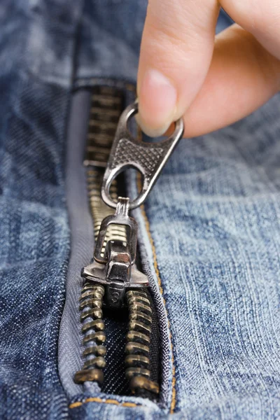Zipper on dark jeans closeup — Stok fotoğraf