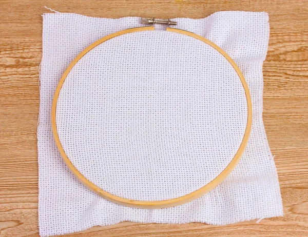 Embroidery hoop in the table — Stock Photo, Image