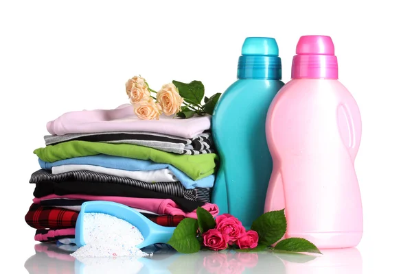 stock image Detergent with washing powder and pile of colorful clothes isolated on whit