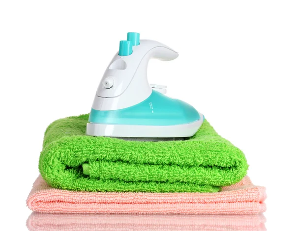 Two towels and iron isolated on white — Stock Photo, Image