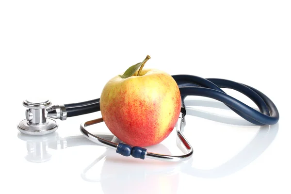 Medical stethoscope and apple isolated on white — Stock Photo, Image