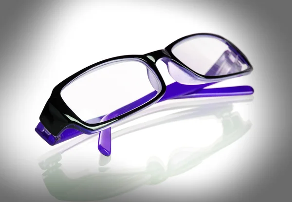 Violet glasses on grey — Stock Photo, Image