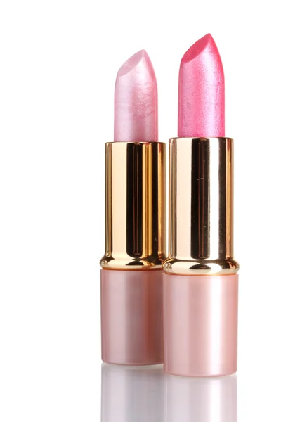 Schöne rosa Lippenstifte isoliert auf weiß — Stockfoto