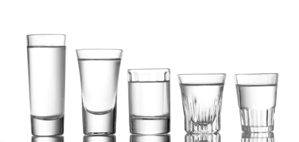 Veel glas wodka geïsoleerd op wit — Stockfoto