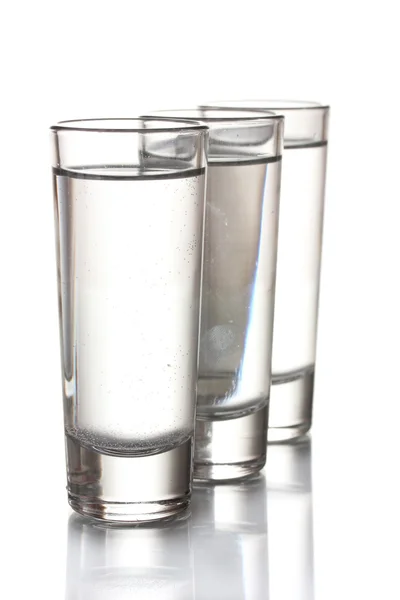 Три склянки горілки ізольовані на білому — стокове фото