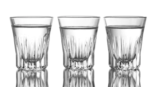 Tres vasos de vodka aislados en blanco — Foto de Stock
