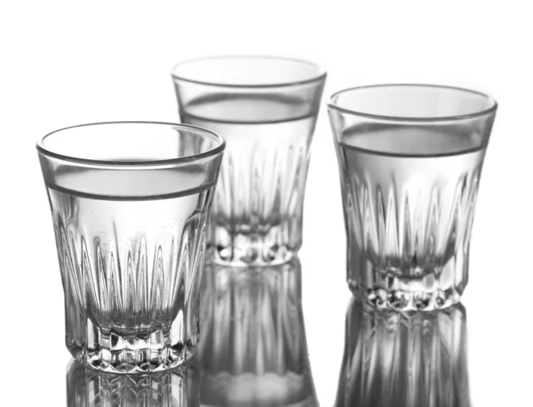 Tres vasos de vodka aislados en blanco —  Fotos de Stock