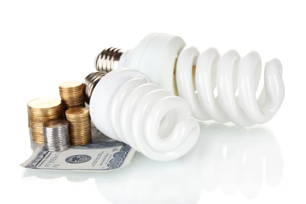 Úsporná lampa a peníze izolovaných na bílém — Stock fotografie