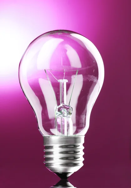 stock image Light bulb on pink background