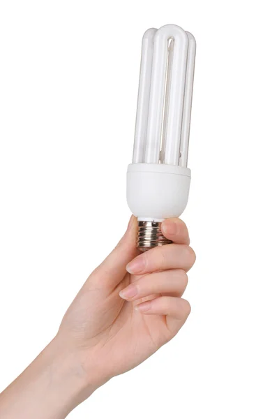 Arm hält Energiesparlampe isoliert auf weiß — Stockfoto