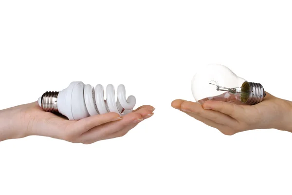 Woman's hand offering ordinary light bulb and the other woman's h — Stock Photo, Image