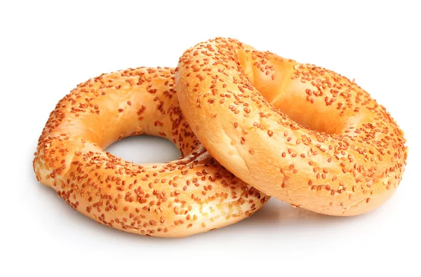 Delicious bagels with sesame seeds isolated on white — Stock Photo, Image
